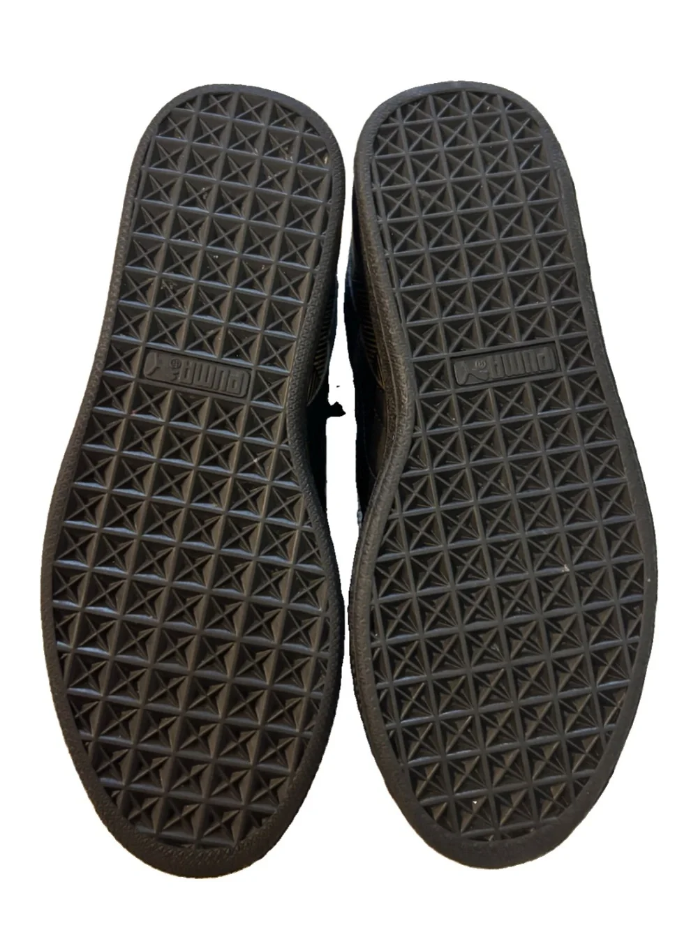 Puma low-top sneaker in black and metallic gold geometric print